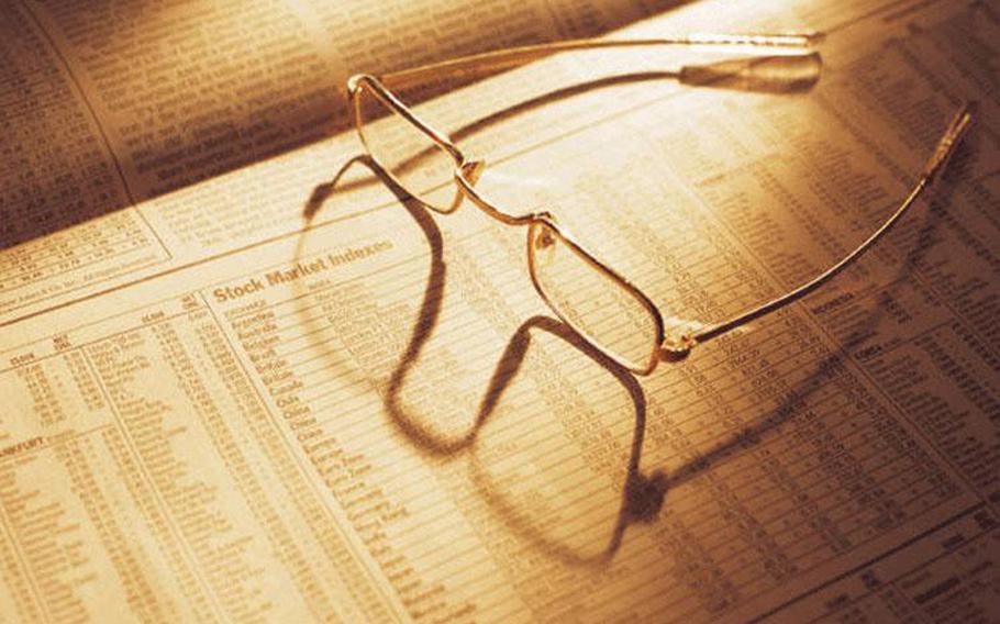 A pair of glasses on the newspaper.